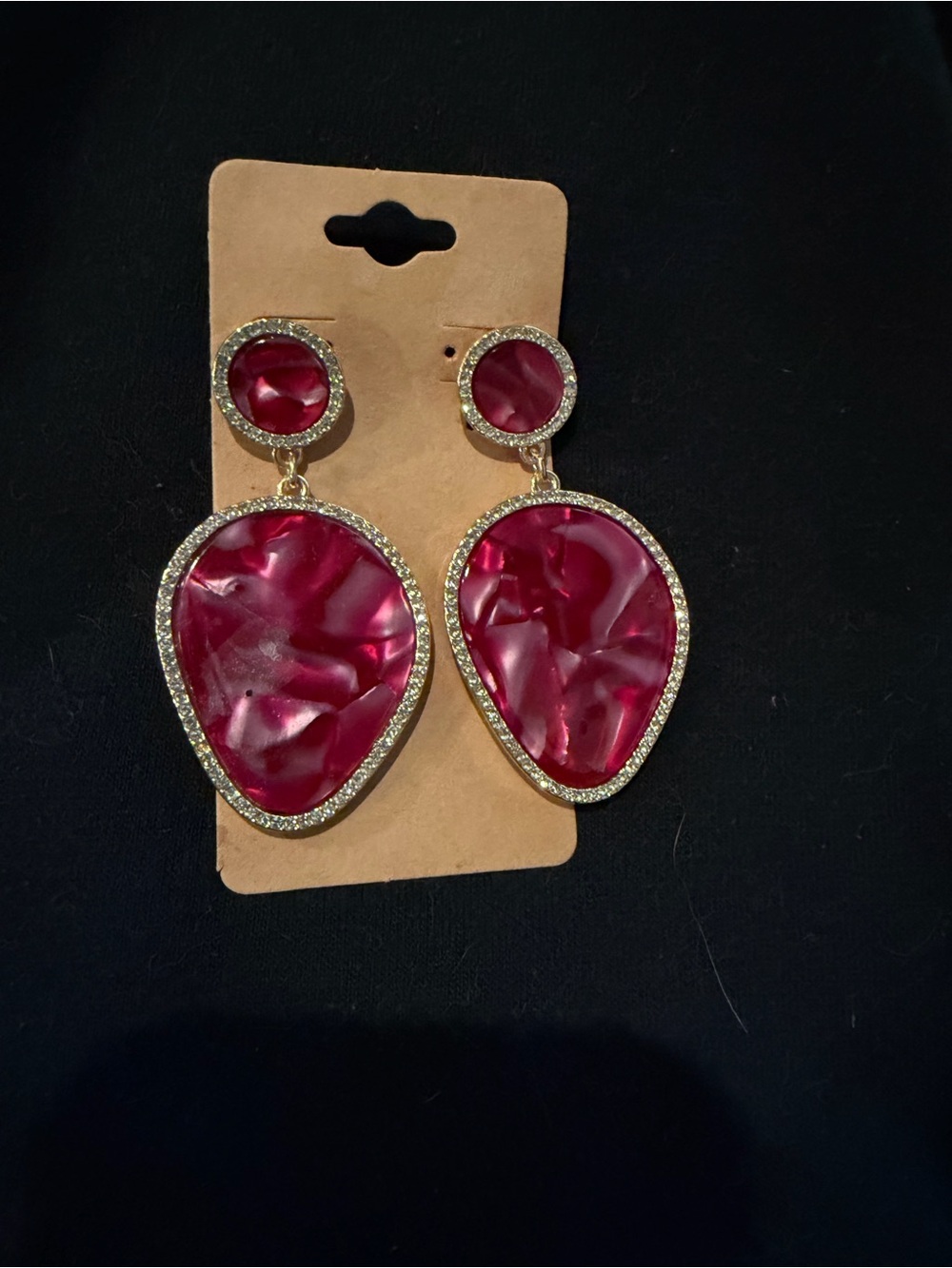 Statement earrings in red with rhinestones